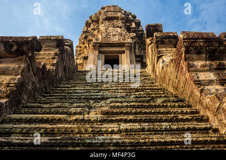 Very steep stairs, leading to one of the five redented towers, shaped like lotus buds, in the sanctuary of Angkor Wat in Siem Reap, Cambodia. Stock Photo