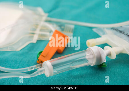 Detail of rubbers of a drip irrigation equipment in hospital operations table, conceptual image Stock Photo