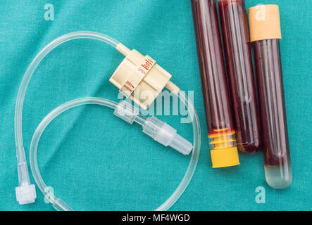 Dial flow regulator next to medicine bag in a hospital, conceptual image Stock Photo