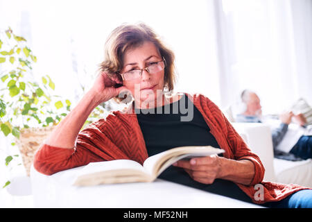 Senior couple relaxing at home. Stock Photo