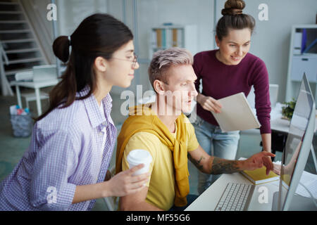 Company employees working in software development and designer office Stock Photo