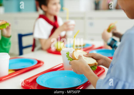 Children eating delicious sandwiches in school canteen Stock Photo - Alamy