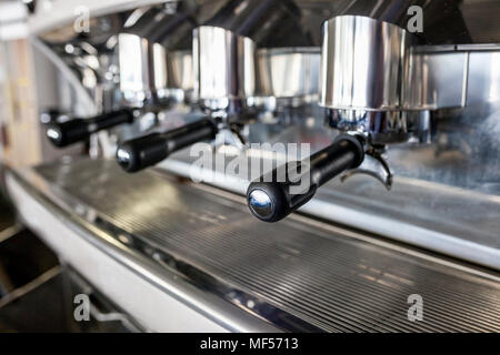 Holders on new vintage bar coffee machine. Selective focus Stock Photo