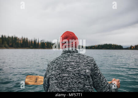 Canada, British Columbia, man in canoe on Boya Lake Stock Photo