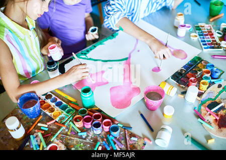 Group of Children Painting Picture Together in Art Class Stock Photo ...