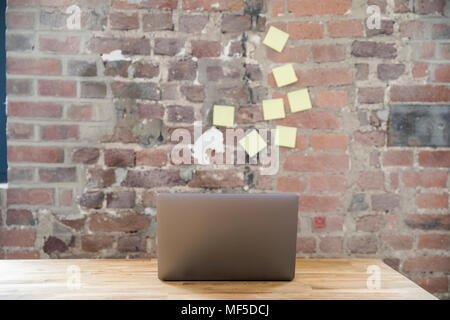 Laptop on wooden tabletop in a loft Stock Photo