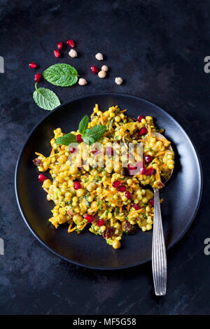 Bowl of Couscous salad with chick peas and cranberries Stock Photo