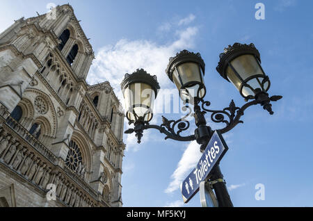 Low angle view of Notre Dame cathedral against the sky in Paris Stock Photo