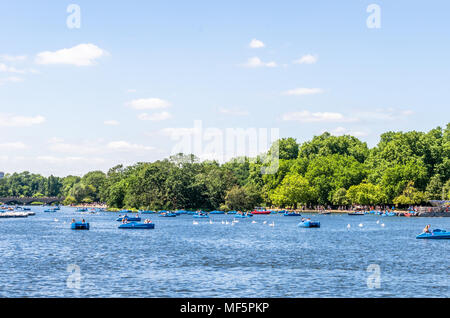 Tourists on recreational boats on the Serperntine at Hyde Park in the City of Westminster, London Stock Photo