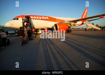 passengers boarding easyjet aircraft from the front steps at bristol airport england uk Stock Photo