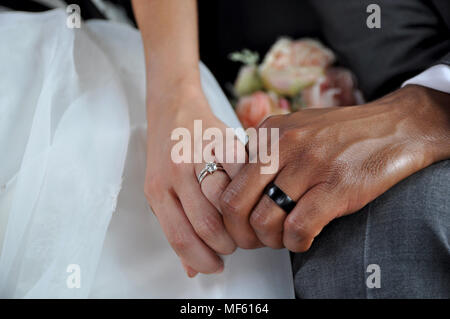 Just Married Interracial Couple Holding Hands Wearing Wedding Rings Stock Photo