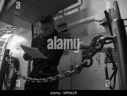 170523-N-QI061-079ATLANTIC OCEAN (May 23, 2017) Fire Controlman 3rd Class Hunter Osterhout from Norwood, N.C. performs maintenance on an escape trunk hatch aboard the guided-missile cruiser USS Monterey (CG 61), May 23, 2017. Monterey is currently underway enroute to Fleet Week New York City. (U.S. Navy photo by Mass Communication Specialist 3rd Class Nathan T. Beard). () Stock Photo