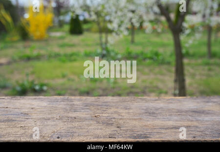 Empty wooden deck table in spring time Stock Photo