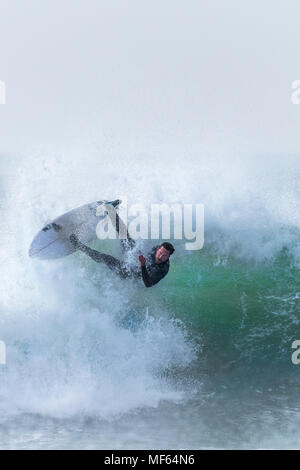 Spectacular surfing action at Fistral Beach in Newquay Cornwall. Stock Photo