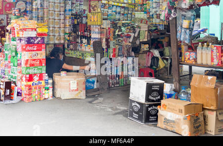 A female shopkeeper in a market stall in the Ton That Dam Street markets, Ho Chi Minh City, Vietnam. Stock Photo