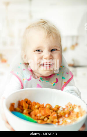 happy children eating steamed vegetables at home kitchen Stock Photo