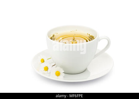 cup of chamomile with splashing drop and daisy on white background Stock Photo