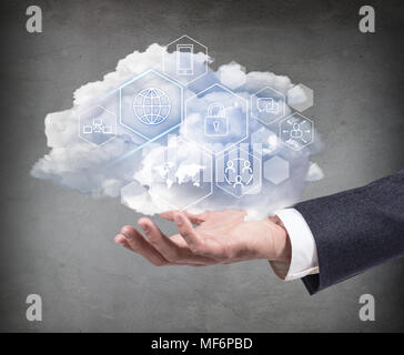 Hand holding cloud with different digital icons. Stock Photo