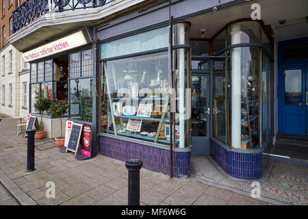 Interestingly shaped shop front to an antique shop on the seafront at Margate in Kent Stock Photo
