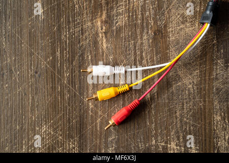 Audio-video analog cable on wooden background with copy-space Stock Photo