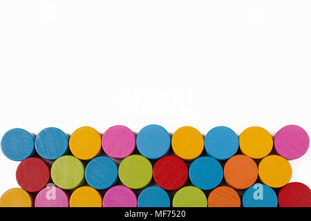 Colored wooden circles on a white background, isolate Stock Photo
