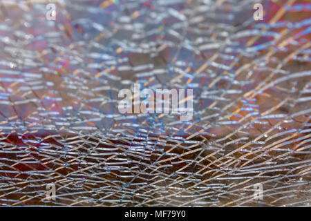 Abstract background: broken tempered glass texture.  Selective focus, High angle view. Stock Photo