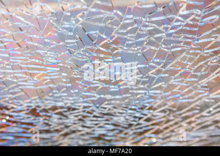 Abstract background: broken tempered glass texture. Selective focus, High angle view. Stock Photo