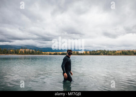 Canada, British Columbia, man diving in Boya Lake Stock Photo