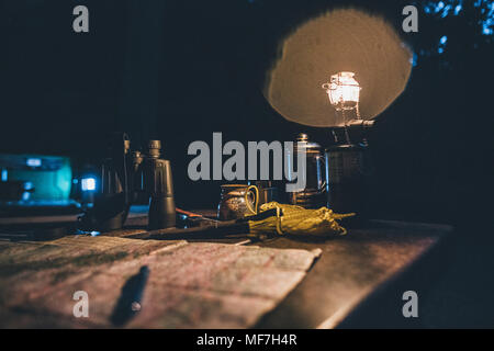 Canada, British Columbia, Columbia-Shuswap A, Glacier National Park, map, binoculars, camping light at night Stock Photo