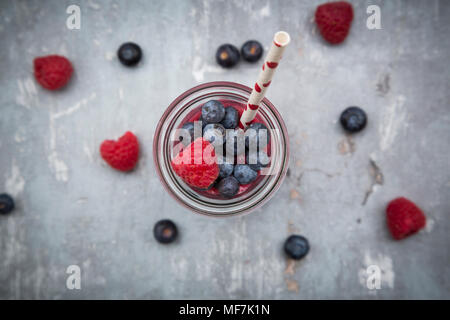 Glass bottle of berry smoothie Stock Photo