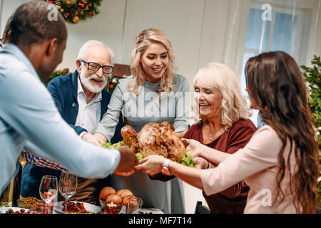 family holding christmas turkey Stock Photo