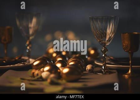 easter decorated table with golden chicken eggs Stock Photo