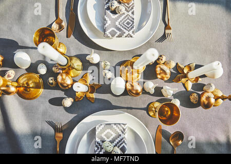 top view of easter decorated table with golden eggs Stock Photo