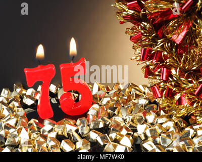 Abstract Background for birthday or anniversary. Red candles showing Nr. 75 Stock Photo