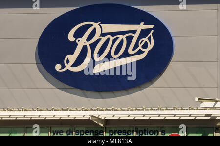 Large sign above the entrance of a Boots store on a retail park Stock Photo