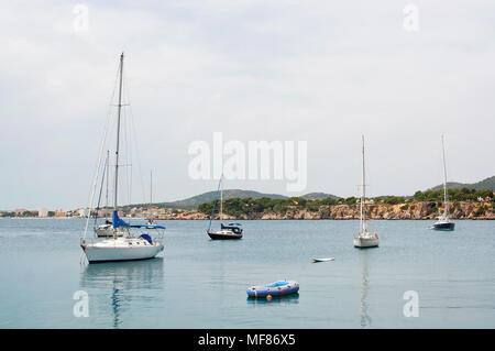 PUERTO PORTALS, MALLORCA, SPAIN - APRIL 24, 2018: Luxury yachts moored in the marina of Puerto Portals on an overcast day on April 24, 2018 in Mallorc Stock Photo