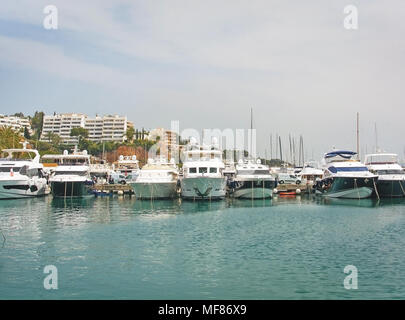 PUERTO PORTALS, MALLORCA, SPAIN - APRIL 24, 2018: Luxury yachts moored in the marina of Puerto Portals on an overcast day on April 24, 2018 in Mallorc Stock Photo