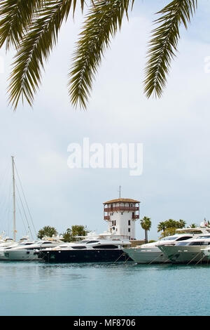 PUERTO PORTALS, MALLORCA, SPAIN - APRIL 24, 2018: Luxury yachts moored in the marina of Puerto Portals on an overcast day on April 24, 2018 in Mallorc Stock Photo