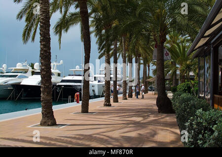 PUERTO PORTALS, MALLORCA, SPAIN - APRIL 24, 2018: Luxury yachts moored in the marina of Puerto Portals on an overcast day on April 24, 2018 in Mallorc Stock Photo