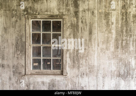 Old Weathered White Window on a Whitewashed Building Stock Photo