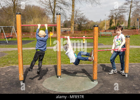 Young children on playground bars Stock Photo - Alamy