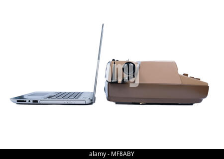 Old typewriter contracted next to a new laptop computer Stock Photo
