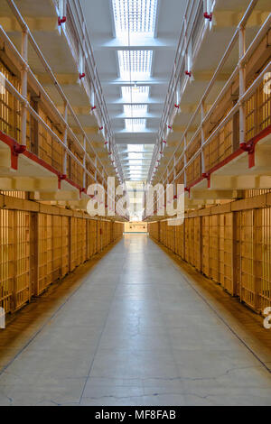 Looking down the central aisle of prison cells at Alcatraz Stock Photo