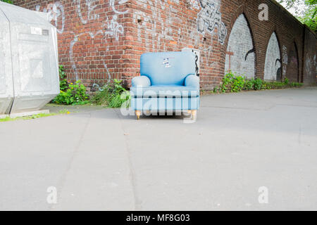 old blue armchair standing at street corner, Köln, Lindenthal Stock Photo