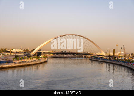 The footbridge view over the new Dubai Water Canal at sunset Stock Photo