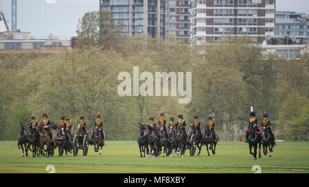 Hyde Park, London, UK. 24 April, 2018. The King’s Troop Royal Horse Artillery charge across Hyde Park to fire celebratory Royal Salutes at 2pm on Tuesday 24th April to mark the birth of a new Royal baby, the Duke and Duchess of Cambridge’s third child. 71 horses place six First World War era 13-pounder Field Guns into position for the Royal Salute halfway down Park Lane, blank artillery rounds are fired at ten-second intervals until forty-one shots have been fired. Credit: Malcolm Park/Alamy Live News.