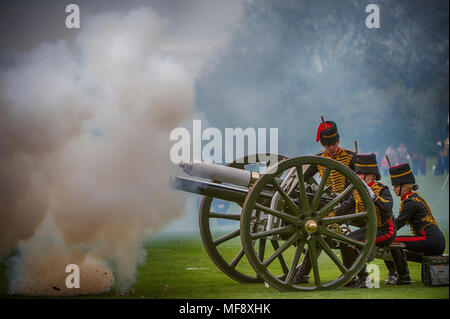 Hyde Park, London, UK. 24 April, 2018. The King’s Troop Royal Horse Artillery fire celebratory Royal Salutes at 2pm on Tuesday 24th April to mark the birth of a new Royal baby, the Duke and Duchess of Cambridge’s third child. 71 horses place six First World War era 13-pounder Field Guns into position for the Royal Salute halfway down Park Lane, blank artillery rounds are fired at ten-second intervals until forty-one shots have been fired. Credit: Malcolm Park/Alamy Live News.
