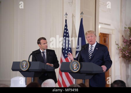 Washington, USA. 24th Apr, 2018. U.S. President Donald Trump (R) and French President Emmanuel Macron attend a joint press conference at the White House in Washington, DC, the United States, April 24, 2018. Macron is on a state visit to the United States from Monday to Wednesday. Credit: Yang Chenglin/Xinhua/Alamy Live News Stock Photo