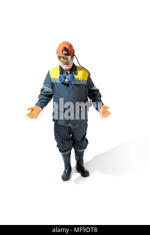 The studio shot of senior bearded male miner standing at the camera on a white background. Stock Photo