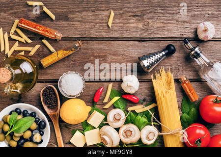 Italian food ingredients for the preparation pasta on wooden background Stock Photo